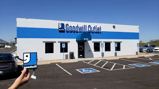 Goodwill Outlet Store and Donation Center in Nogales, Arizona, displaying a large open layout with rows of donation bins.