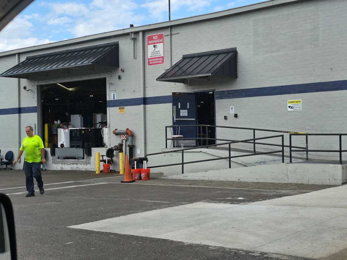 Goodwill Outlet Store and Donation Center, a Goodwill outlet store highlighting organized racks of clothing near the checkou.