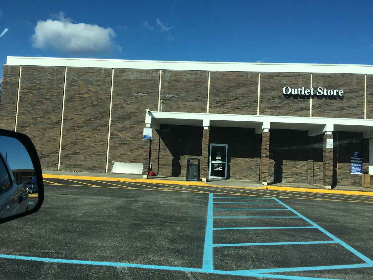 Goodwill Outlet Store and Donation Center, a Goodwill outlet store showing blue rolling bins filled with discounted merchand.