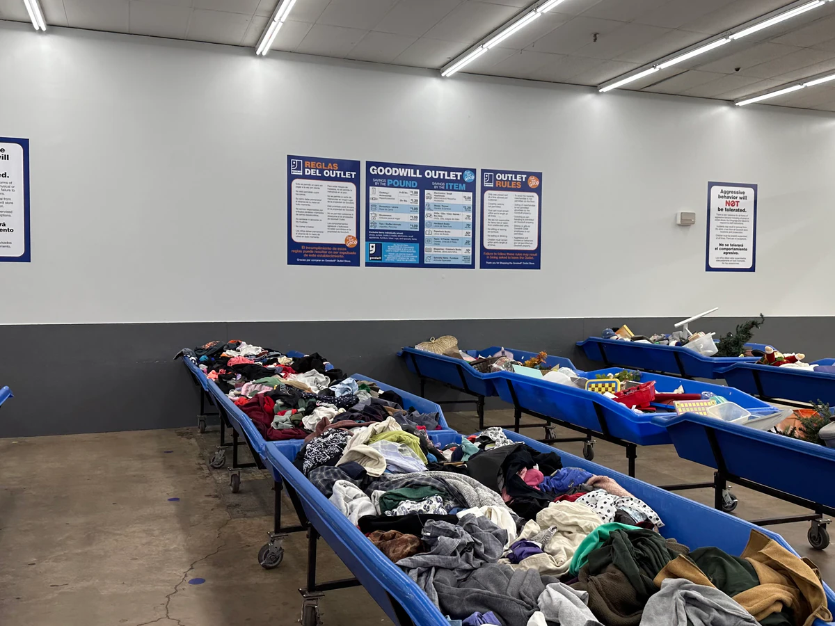 Goodwill Outlet Store and Donation Center in Harrisonburg, Virginia, showing the donation entrance and bulk pricing signage.