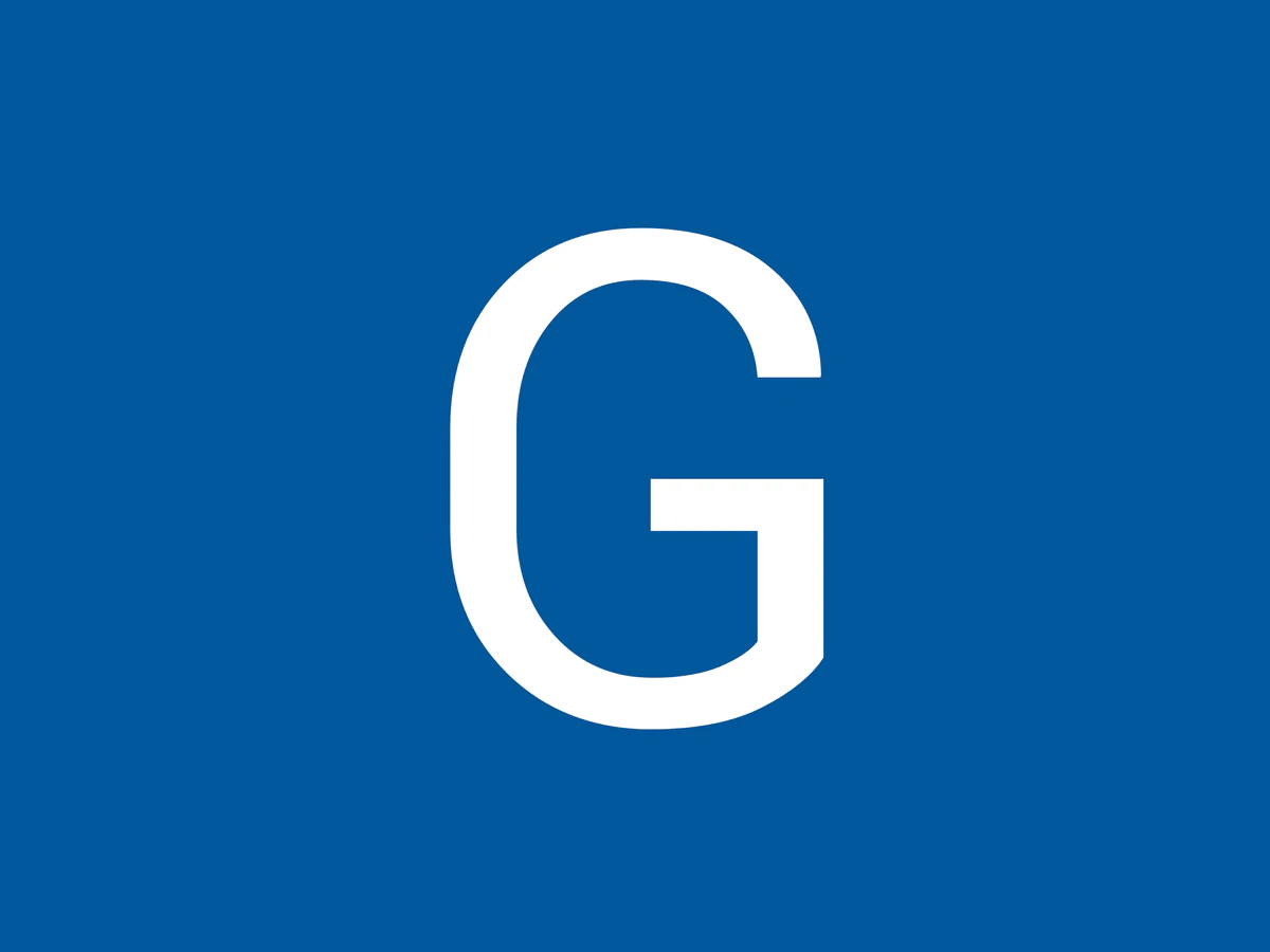 Goodwill Outlet Store in Little Rock, Arkansas, highlighting organized racks of clothing near the checkout area.