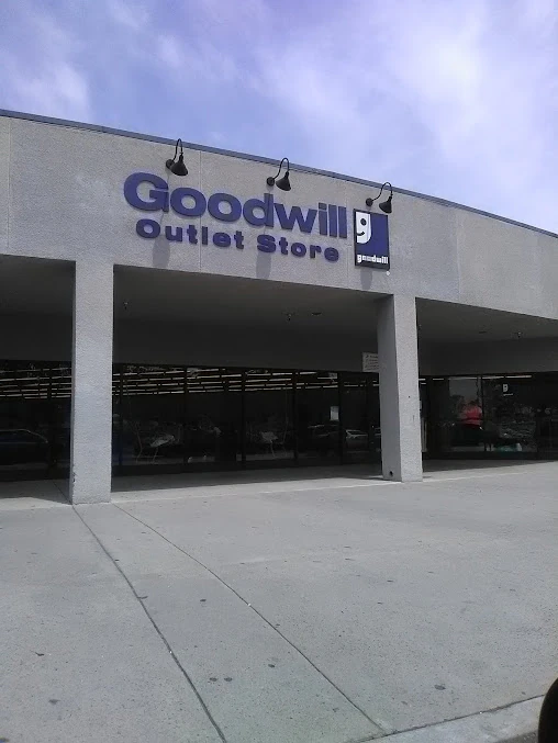 Goodwill Outlet Store in San Bernardino, California, displaying a large open layout with rows of donation bins.