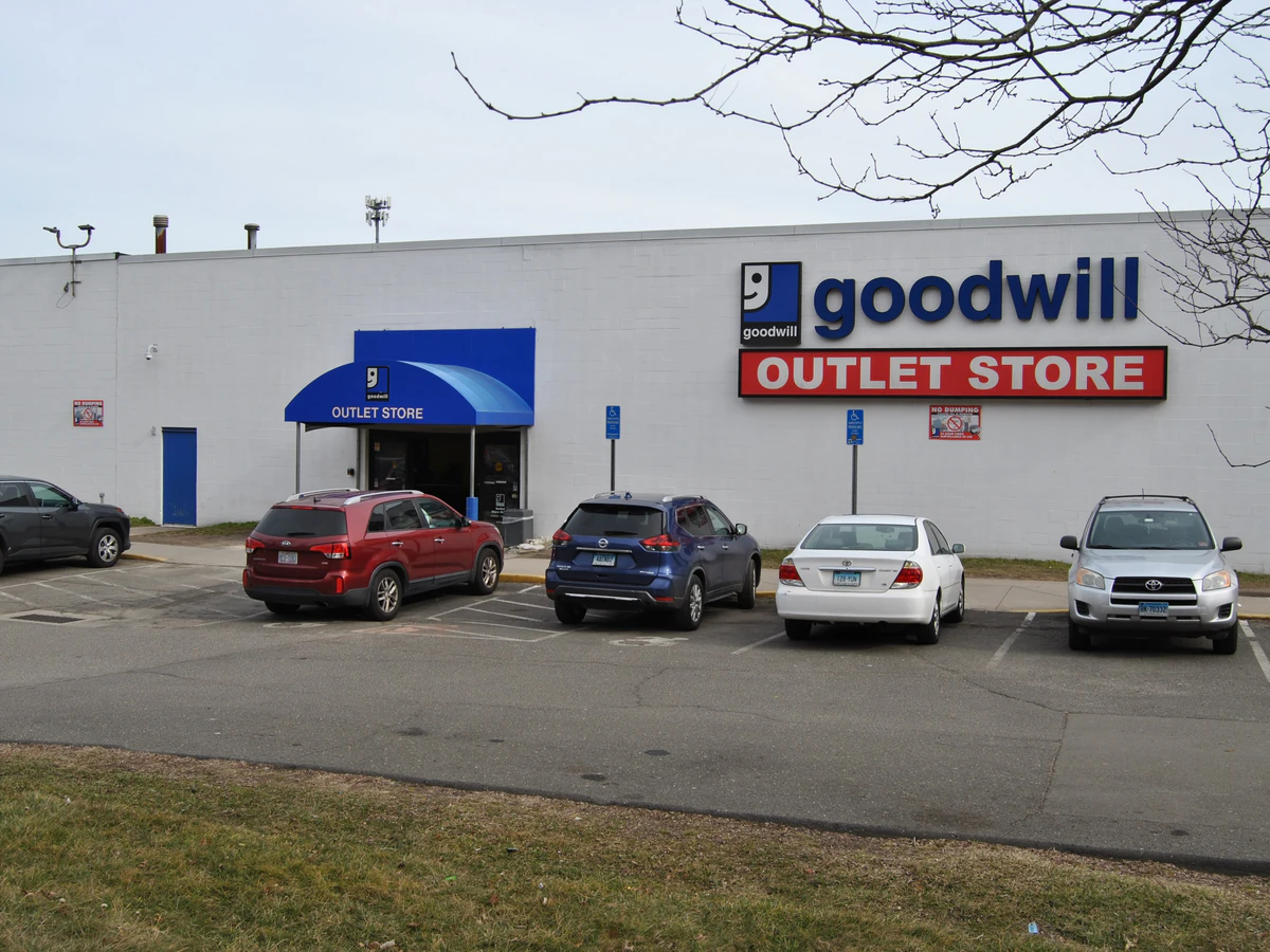 Goodwill Outlet Store in Hamden, Connecticut, showing blue rolling bins filled with discounted merchandise.