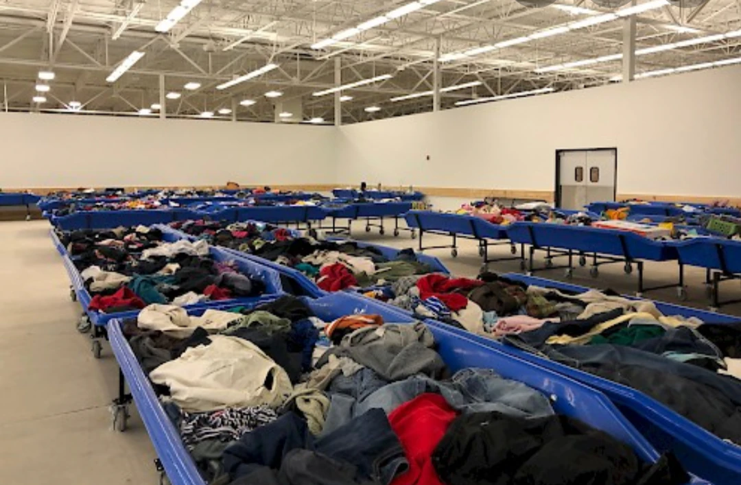 Goodwill Outlet Store in Columbus, Georgia, displaying a large open layout with rows of donation bins.