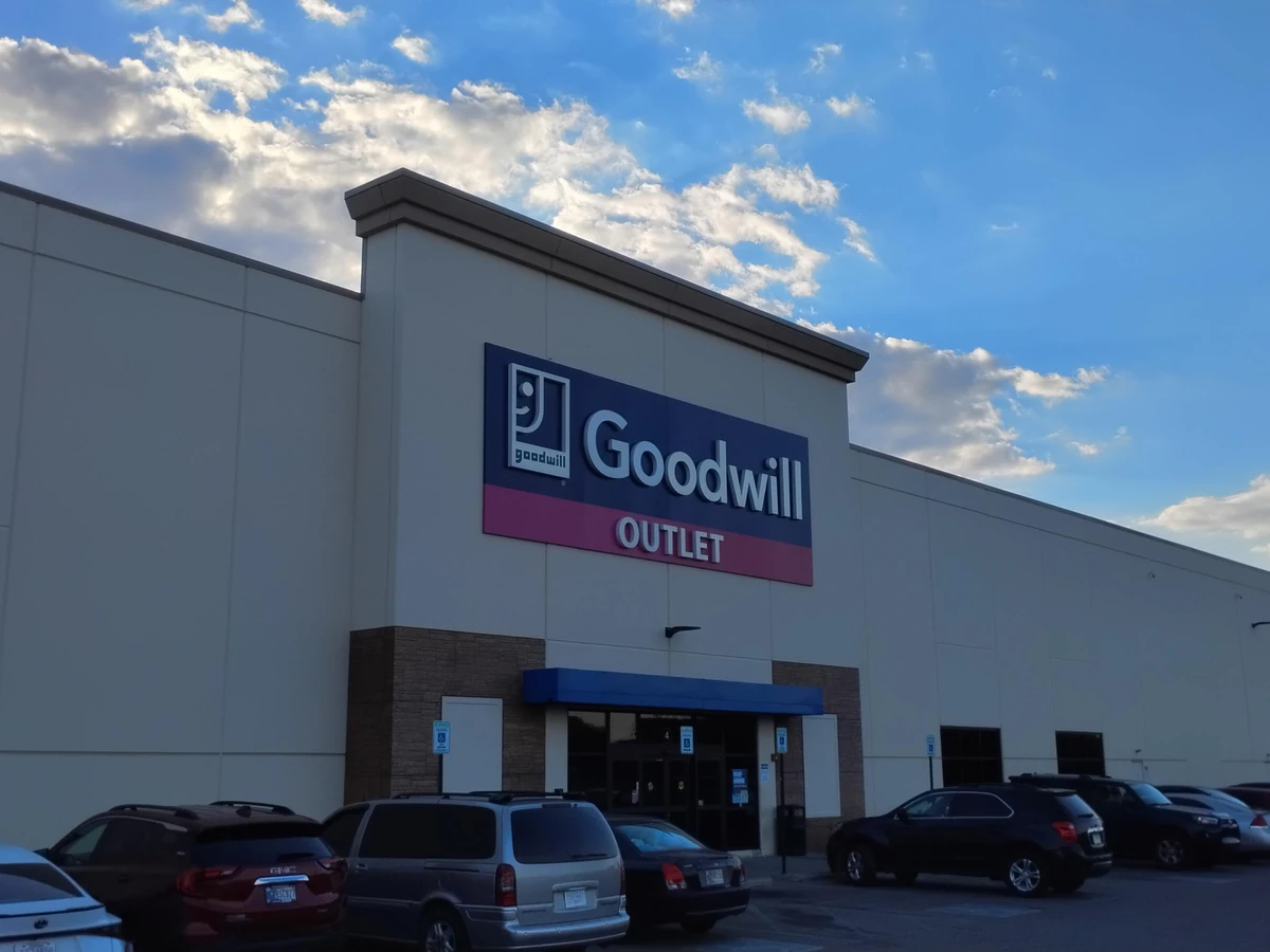 Goodwill Outlet Store in Indianapolis, Indiana, showing blue rolling bins filled with discounted merchandise.