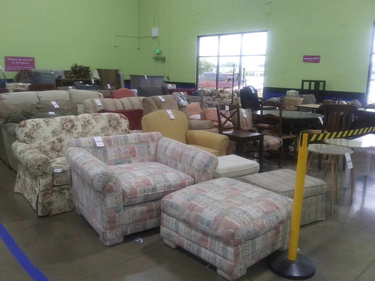 Goodwill Outlet Store in Indianapolis, Indiana, highlighting organized racks of clothing near the checkout area.