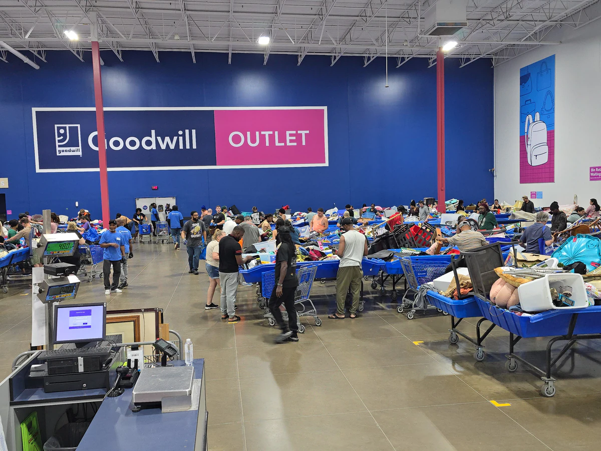 Goodwill Outlet Store in Indianapolis, Indiana, showing the donation entrance and bulk pricing signage.
