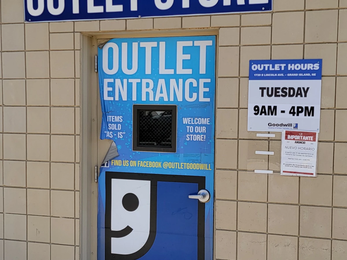 Goodwill Outlet Store in Grand Island, Nebraska, showing blue rolling bins filled with discounted merchandise.