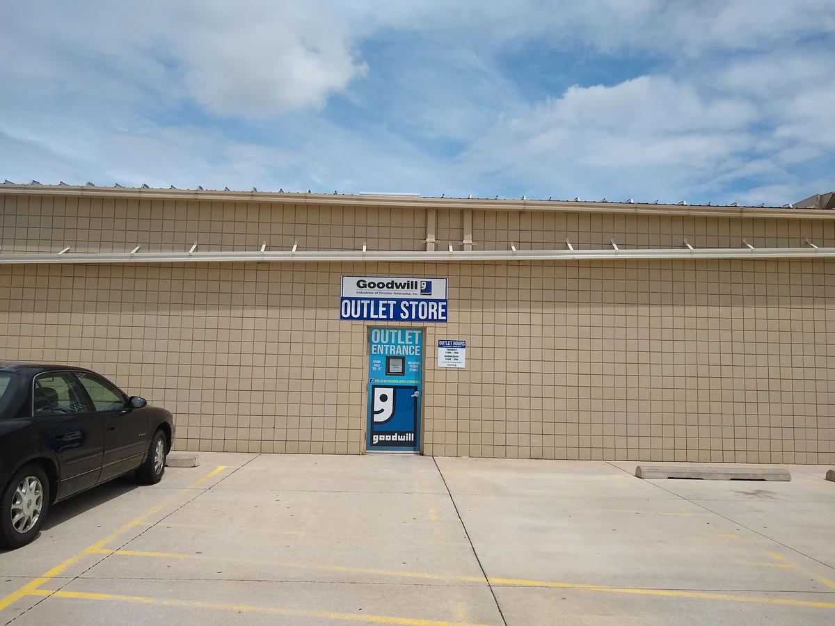 Goodwill Outlet Store in Grand Island, Nebraska, displaying a large open layout with rows of donation bins.