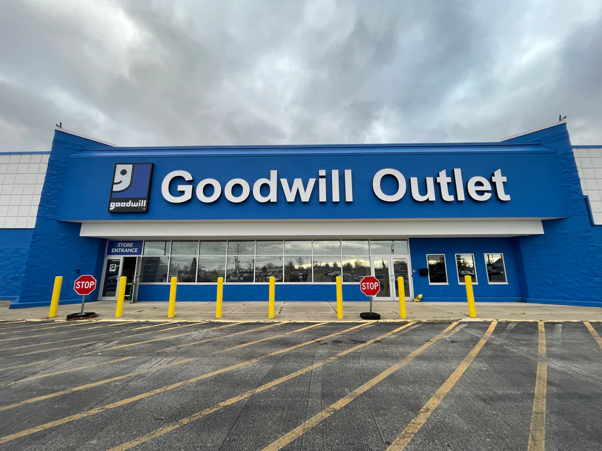 Goodwill Outlet Store in Hamburg, New-york, showing blue rolling bins filled with discounted merchandise.
