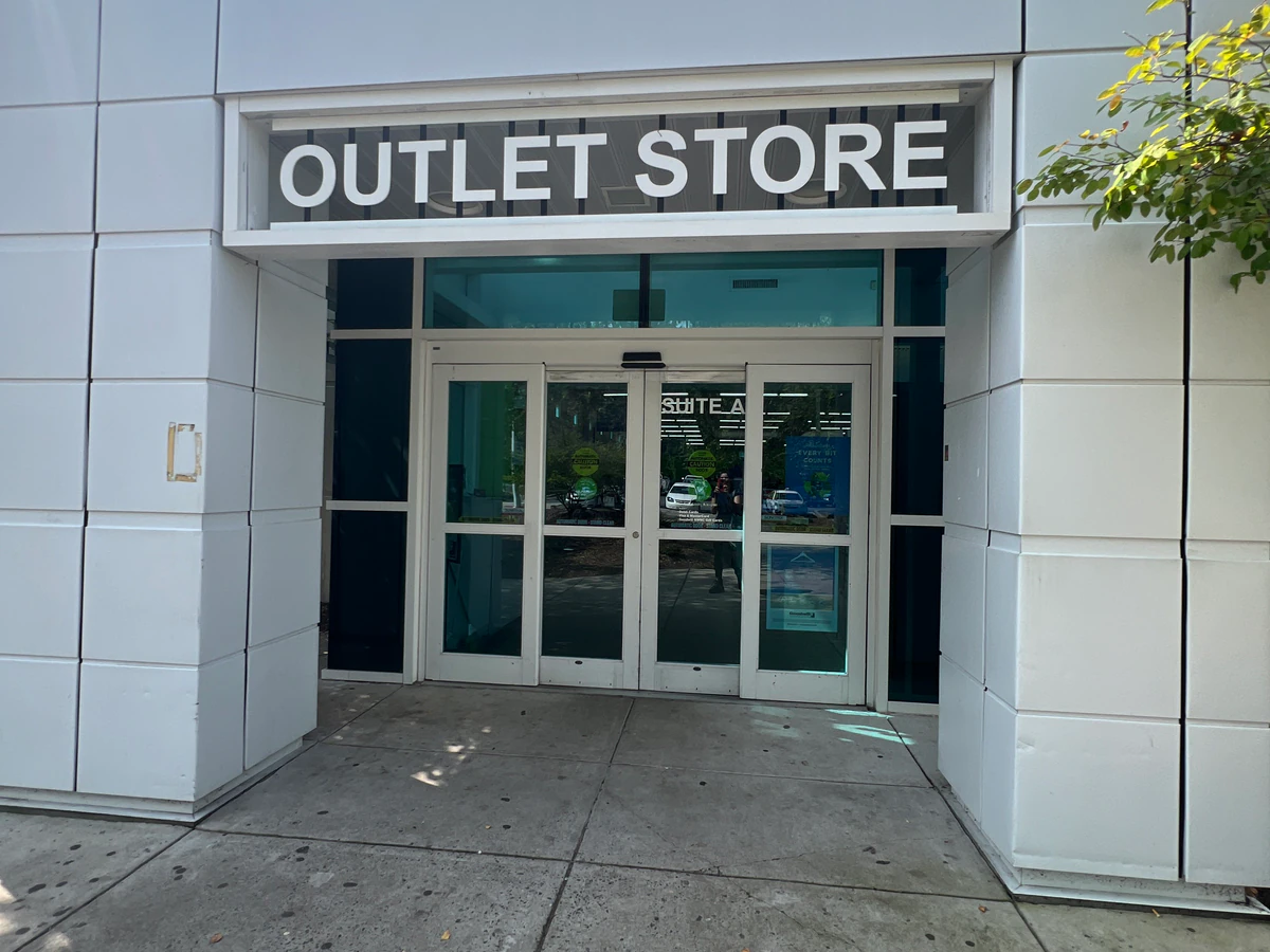 Goodwill Outlet Store in Asheville, North-carolina, showing blue rolling bins filled with discounted merchandise.