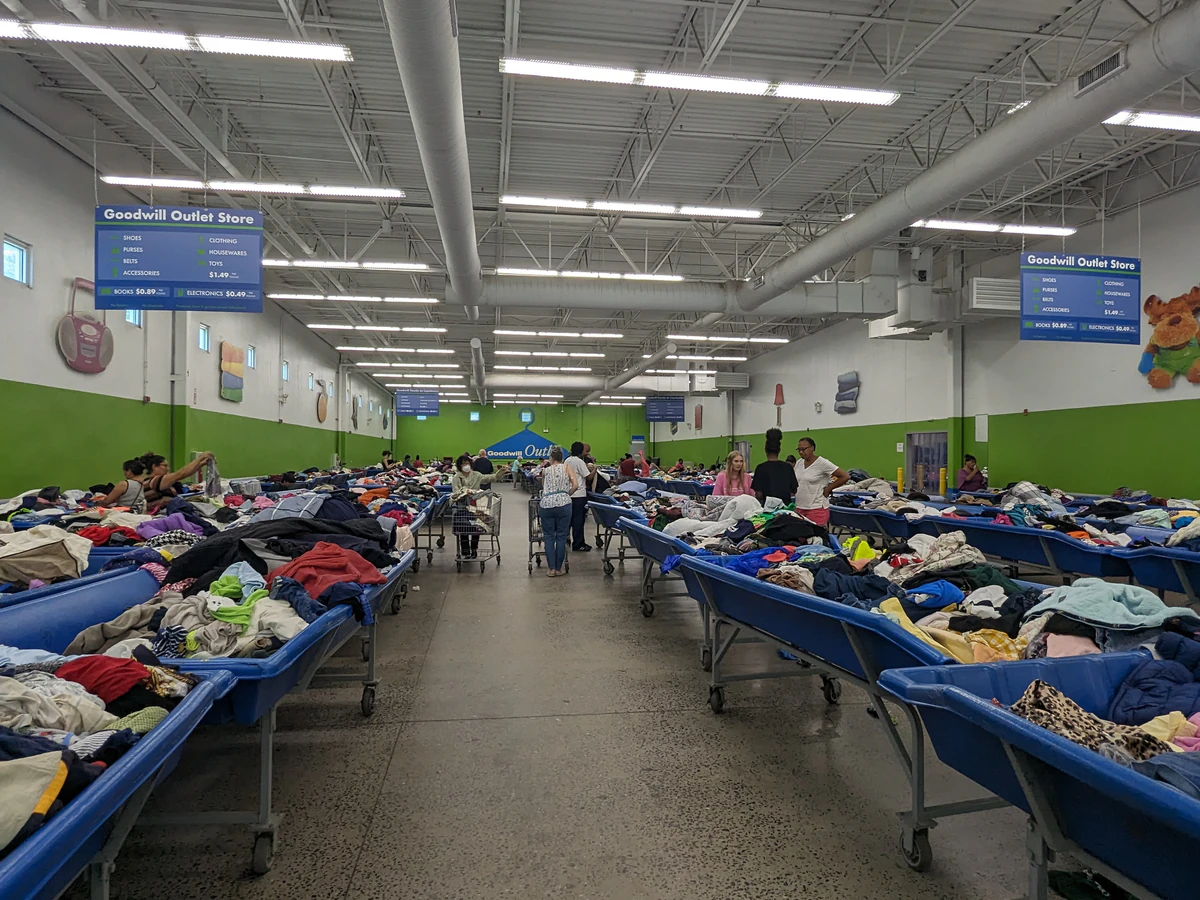 Goodwill Outlet Store in Asheville, North-carolina, displaying a large open layout with rows of donation bins.