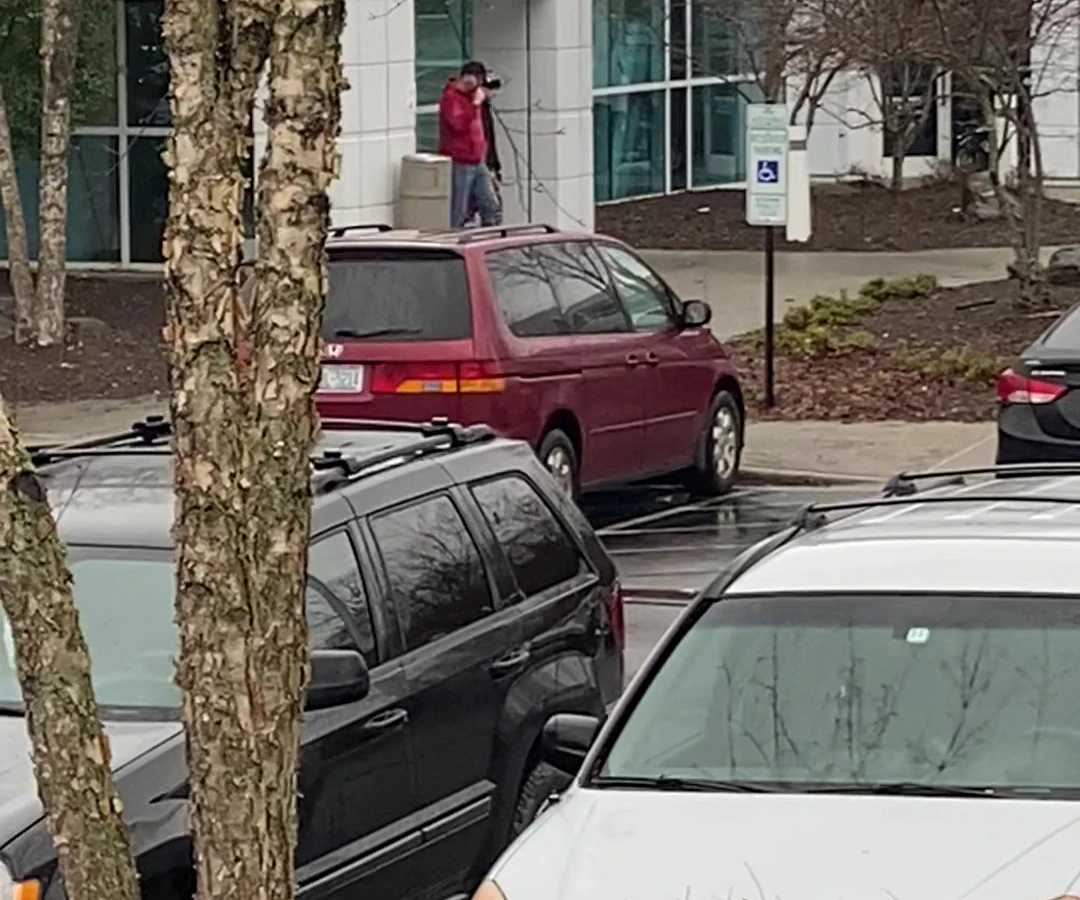 Goodwill Outlet Store in Asheville, North-carolina, featuring shoppers searching through bulk textile containers.