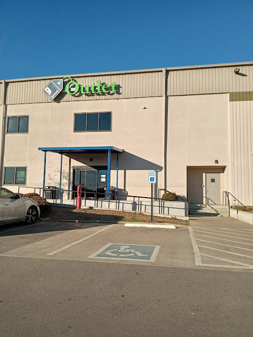 Goodwill Outlet Store in Berry Hill, Tennessee, displaying a large open layout with rows of donation bins.