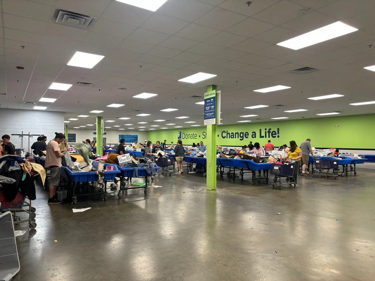 Goodwill Outlet Store in Berry Hill, Tennessee, showing the donation entrance and bulk pricing signage.