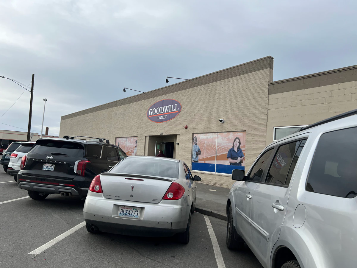 Goodwill Outlet Store in Pasco, Washington, showing blue rolling bins filled with discounted merchandise.