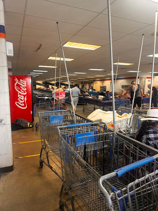 Goodwill Outlet Store in Pasco, Washington, featuring shoppers searching through bulk textile containers.