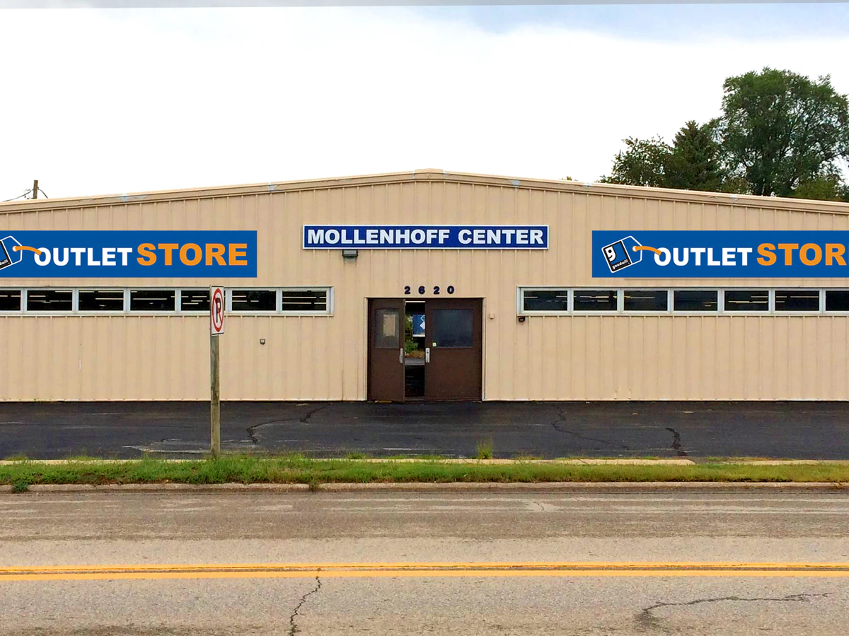 Goodwill Outlet Store Waterloo in Waterloo, Iowa, showing blue rolling bins filled with discounted merchandise.