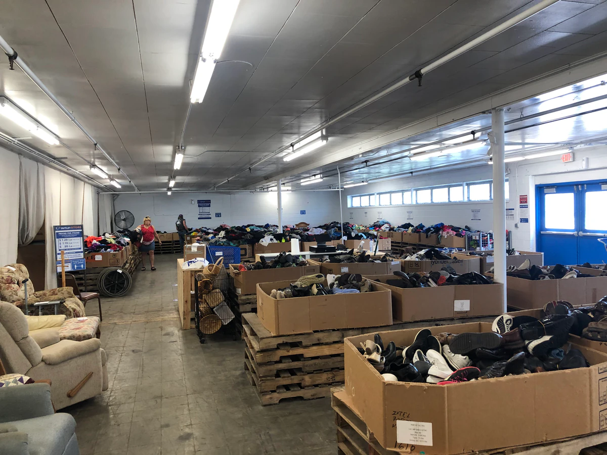 Goodwill Outlet Store Waterloo in Waterloo, Iowa, highlighting organized racks of clothing near the checkout area.