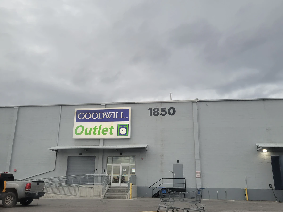 Goodwill Outlet in Salt Lake City, Utah, showing blue rolling bins filled with discounted merchandise.