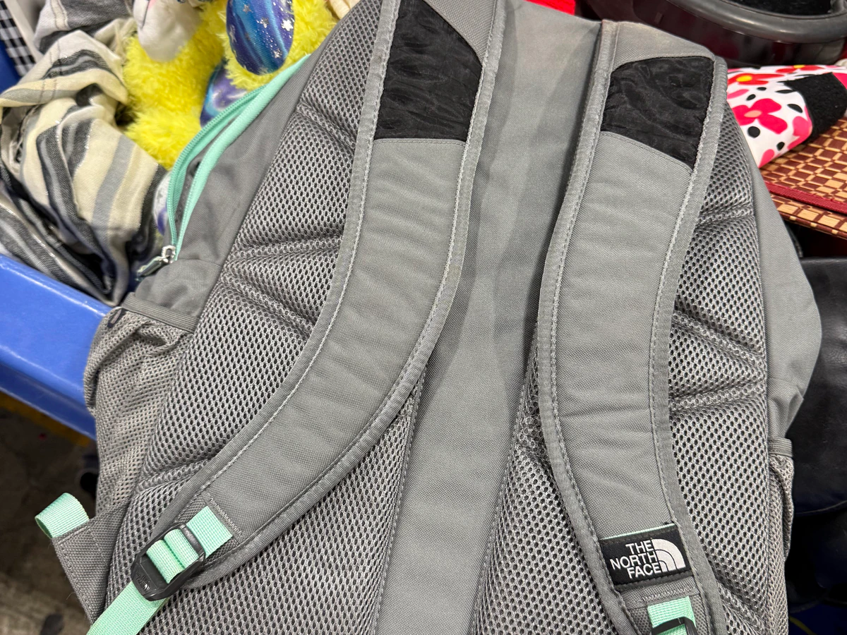 Goodwill Outlet in Salt Lake City, Utah, highlighting organized racks of clothing near the checkout area.