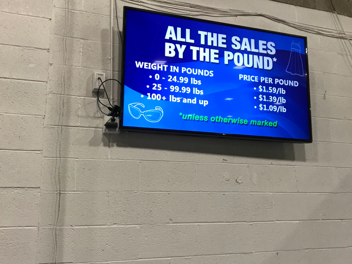 Goodwill Outlet in Salt Lake City, Utah, a Goodwill outlet store showing the donation entrance and bulk pricing signage.