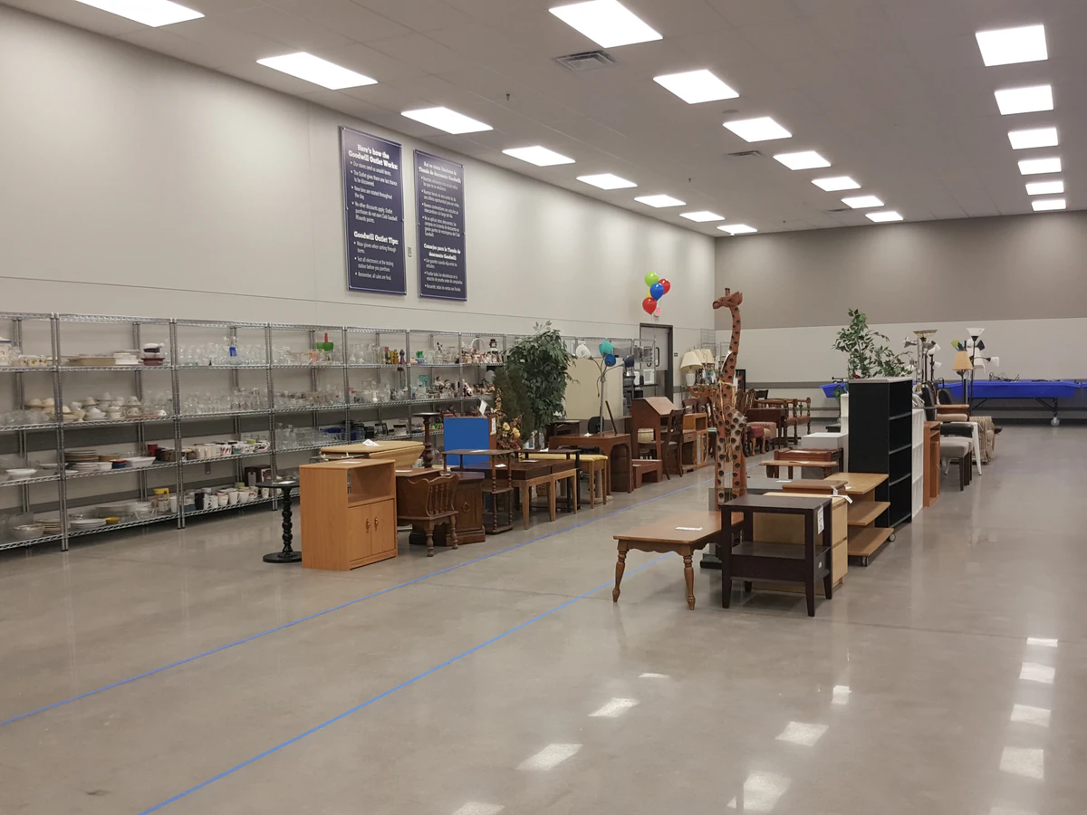 Goodwill Outlet in Milwaukee, Wisconsin, highlighting organized racks of clothing near the checkout area.