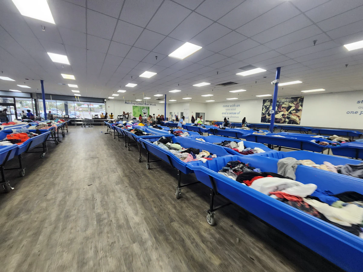 Goodwill - Pine Hills Outlet in Orlando, Florida, displaying a large open layout with rows of donation bins.