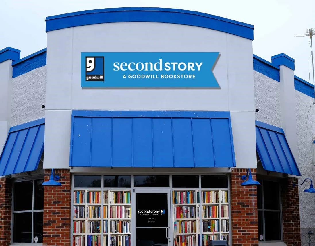 Goodwill SecondStory Bookstore in Greenville, South-carolina, showing neatly organized clothing racks and household goods.