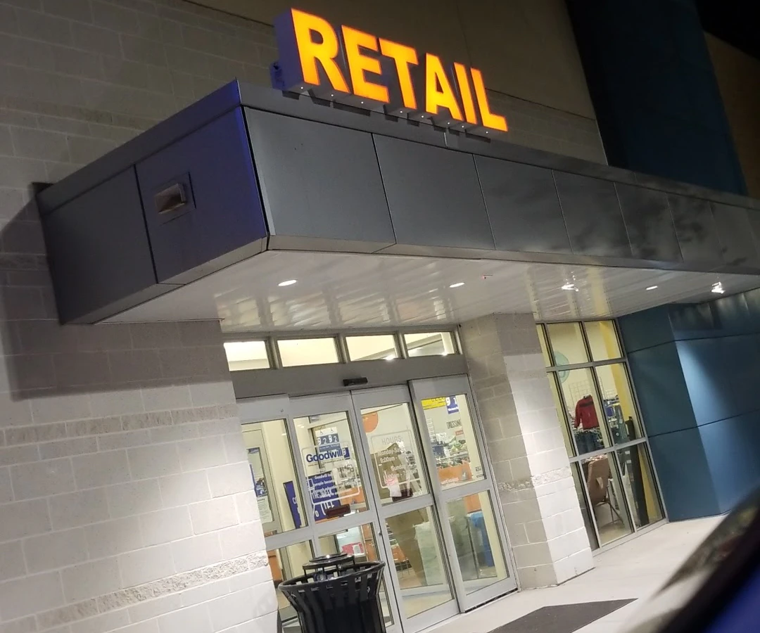 Goodwill in West Columbia, South-carolina, showing neatly organized clothing racks and household goods.