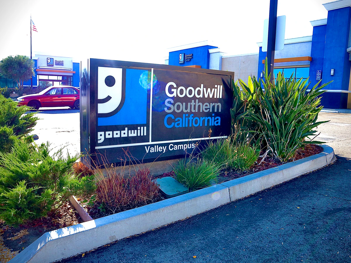 Goodwill Southern California Outlet Store, a Goodwill outlet store showing blue rolling bins filled with discounted merchand.