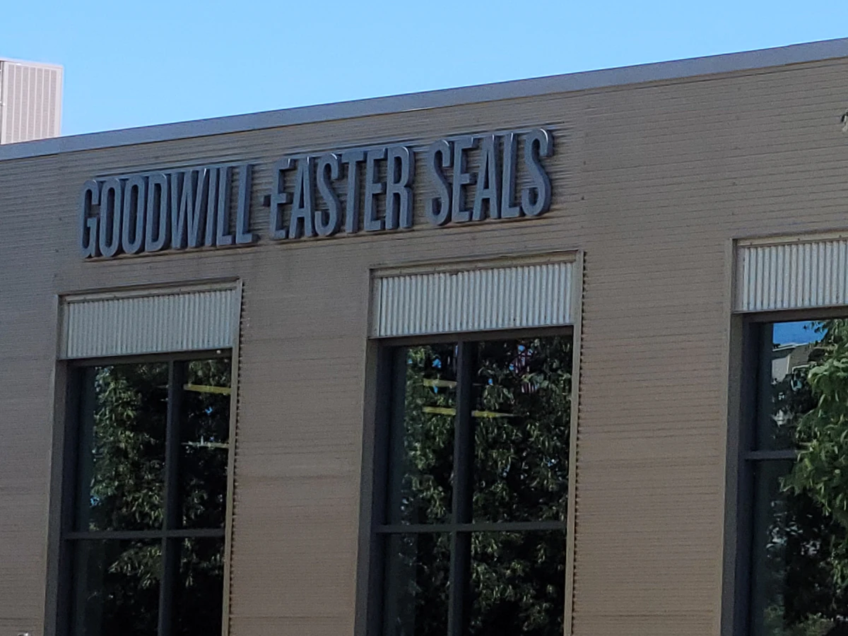 Goodwill - St. Paul Outlet in St Paul, Minnesota, showing blue rolling bins filled with discounted merchandise.