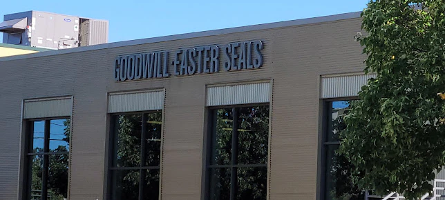 Goodwill - St. Paul Outlet in St Paul, Minnesota, displaying a large open layout with rows of donation bins.