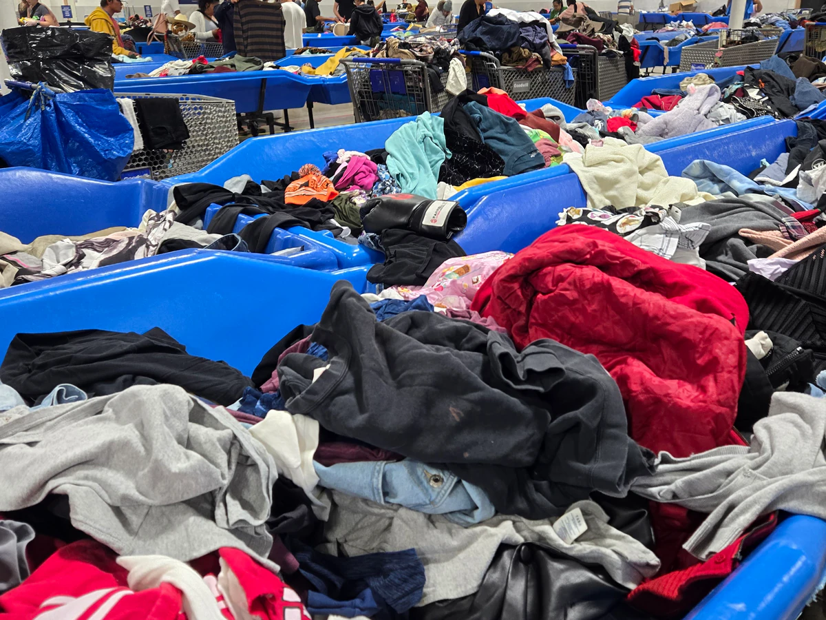 Goodwill - St. Paul Outlet in St Paul, Minnesota, highlighting organized racks of clothing near the checkout area.