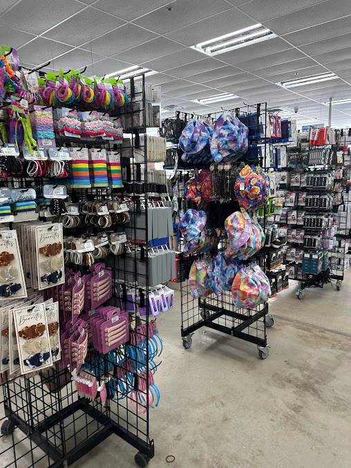 Goodwill St Petersburg Store in St. Petersburg, Florida, showing rows of affordable footwear and accessories for sale.