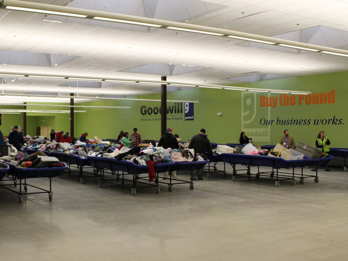 Goodwill Store and Buy the Pound Outlet in Hudson, New-hampshire, displaying a large open layout with rows of donation bins.