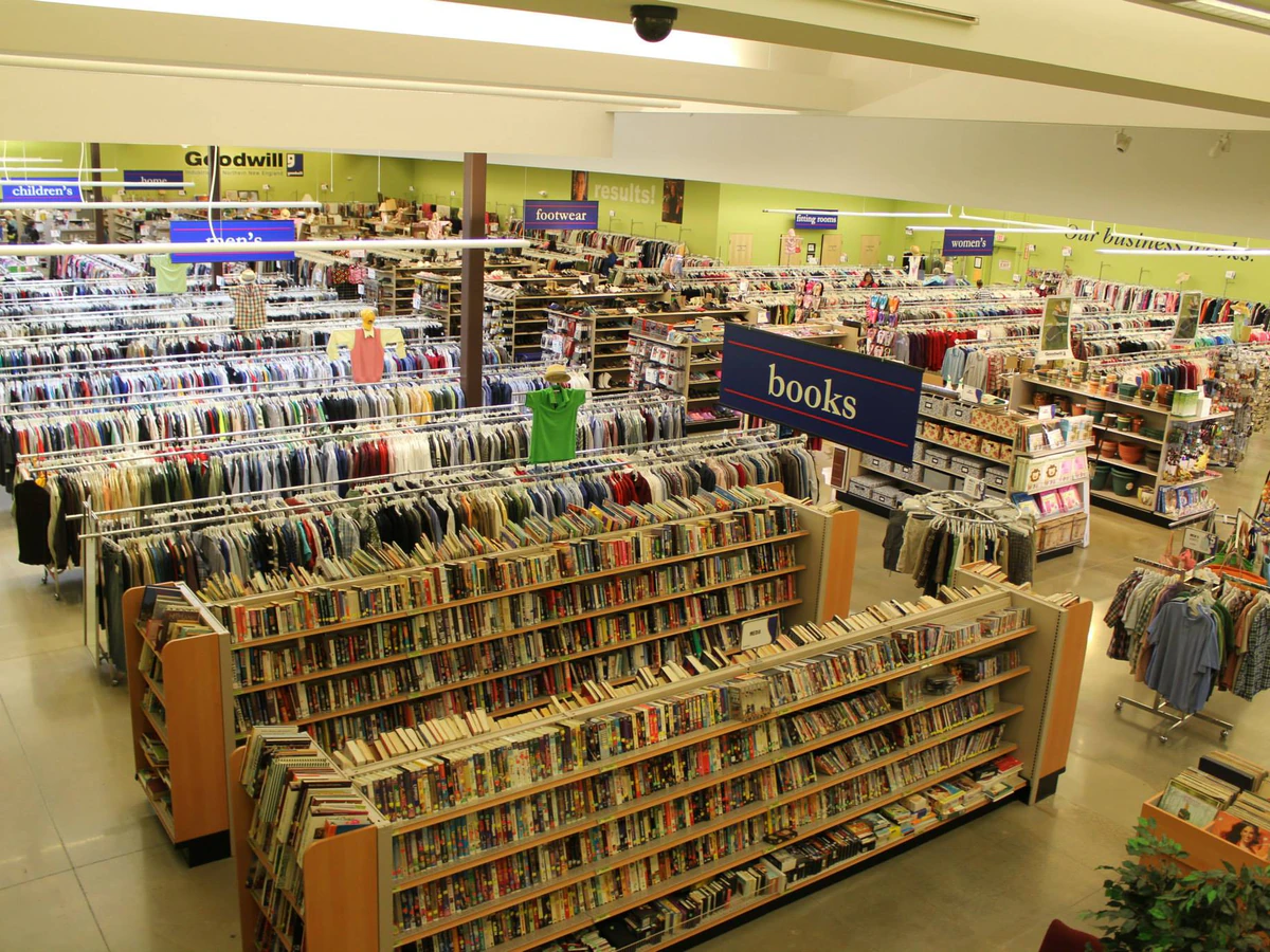 Goodwill Store and Buy the Pound Outlet, a Goodwill outlet store featuring shoppers searching through bulk textile container.