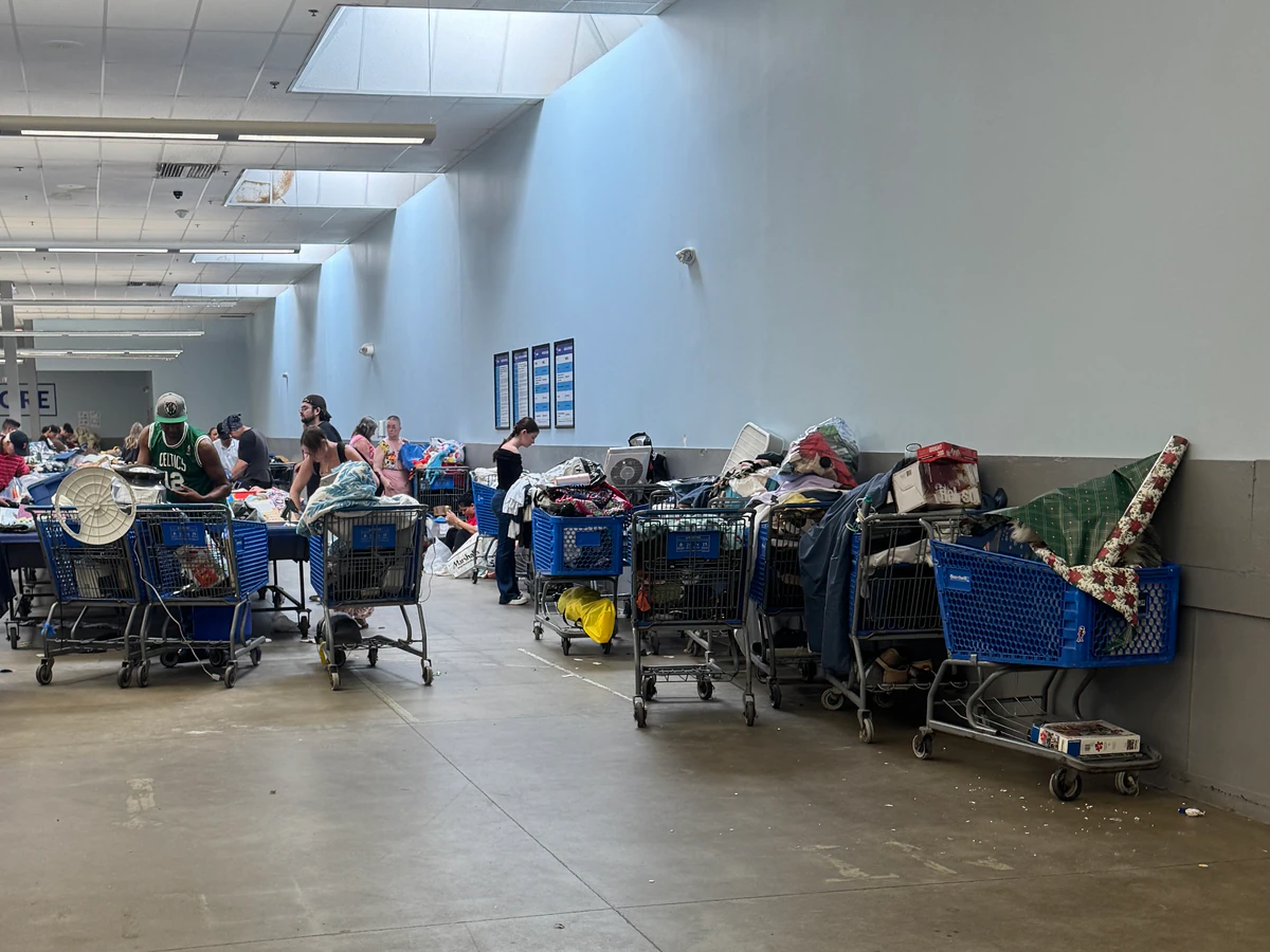 Goodwill Store and Buy the Pound Outlet, a Goodwill outlet store highlighting organized racks of clothing near the checkout .