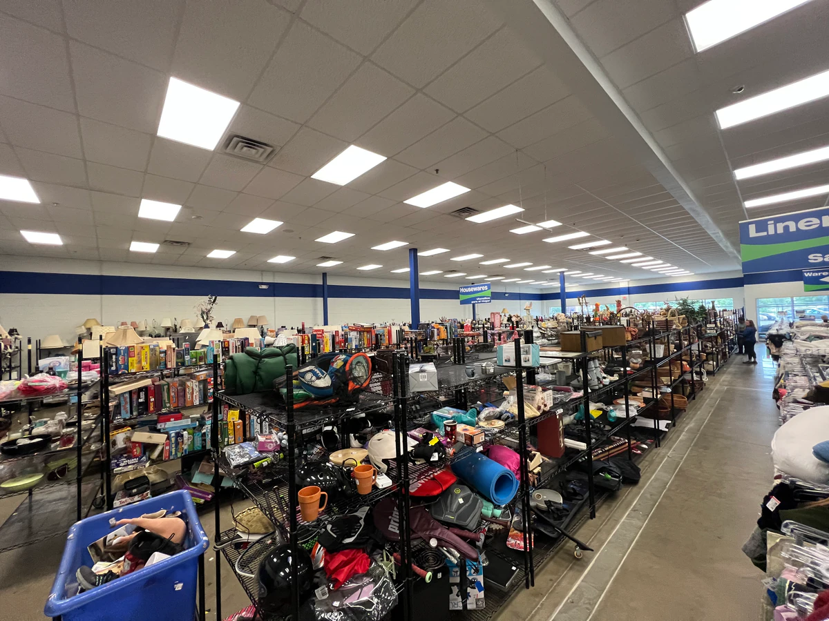 Goodwill Store & Donation Center in Avondale, Pennsylvania, featuring display shelves with books and home decor items.