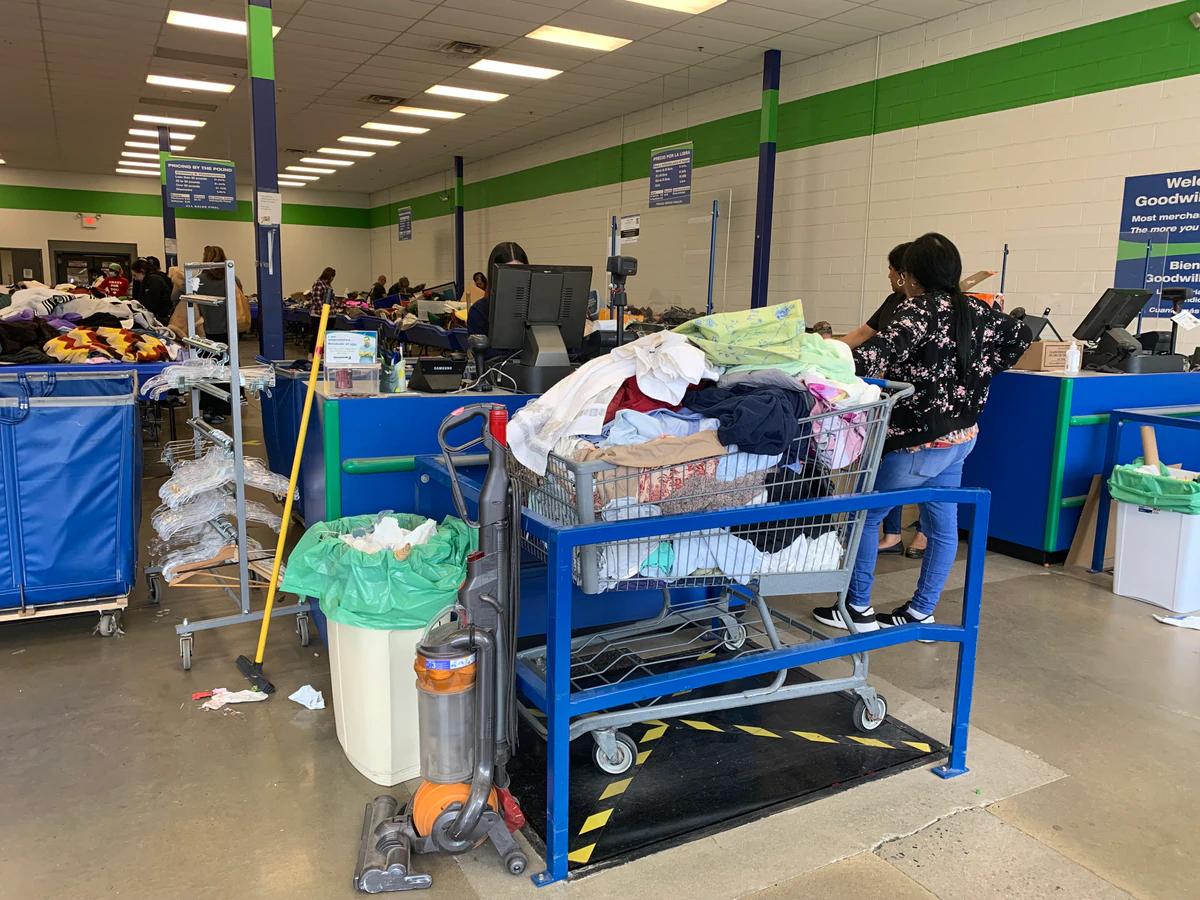 Goodwill Store & Donation Center in Avondale, Pennsylvania, showing rows of affordable footwear and accessories for sale.