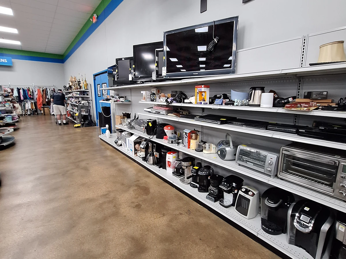 Goodwill Store in Memphis, Tennessee, a Goodwill thrift store showing rows of affordable footwear and accessories for sale.