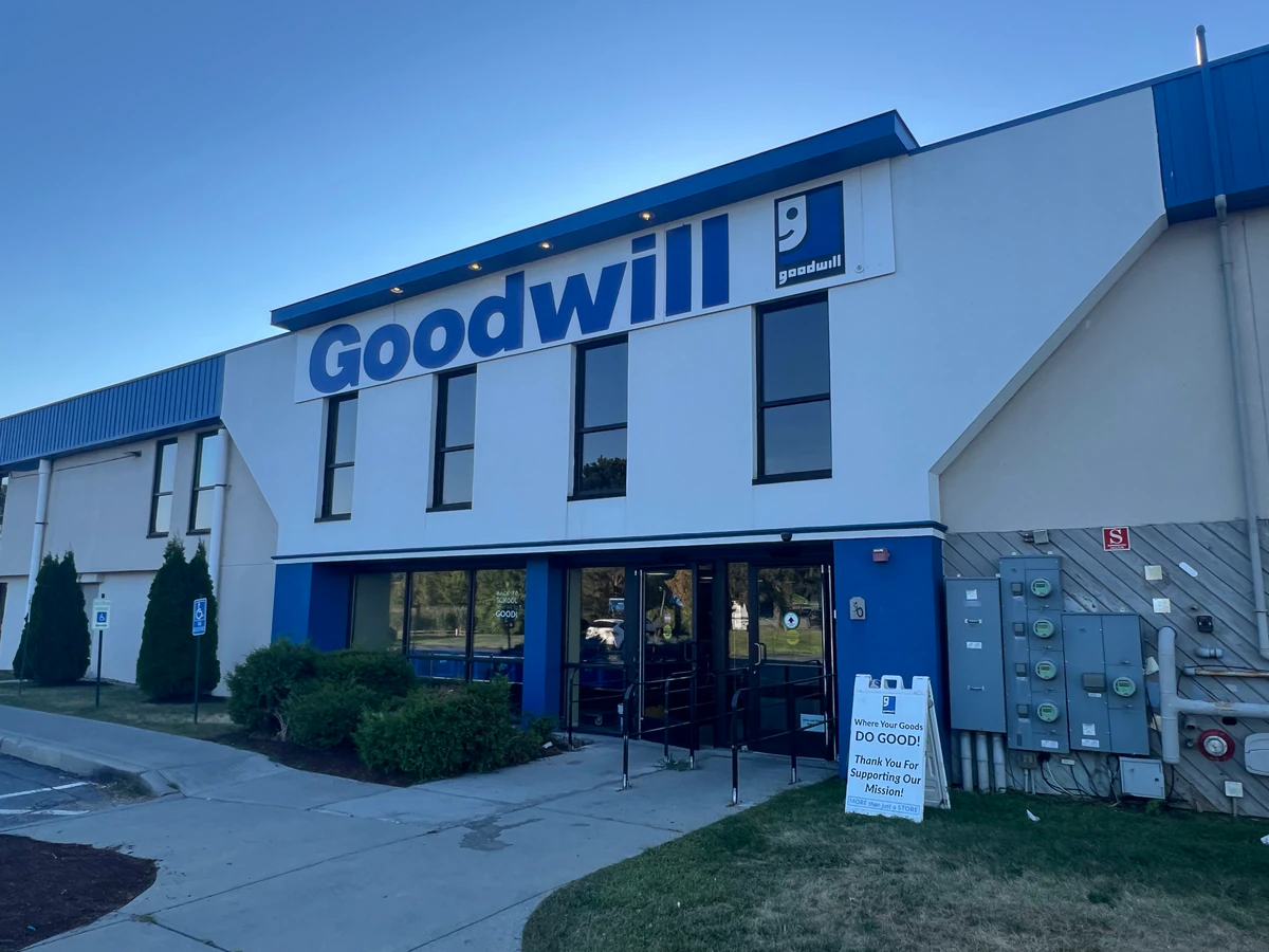 Goodwill Store: Williston in Williston, Vermont, showing neatly organized clothing racks and household goods.