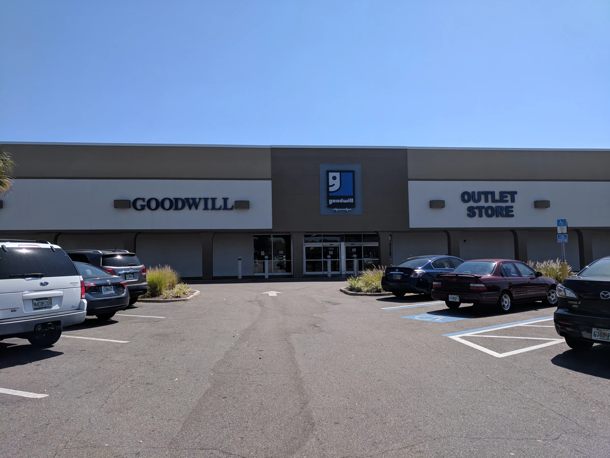 Goodwill - Taft Outlet in Orlando, Florida, showing blue rolling bins filled with discounted merchandise.