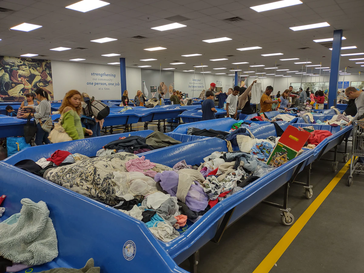 Goodwill - Taft Outlet in Orlando, Florida, highlighting organized racks of clothing near the checkout area.