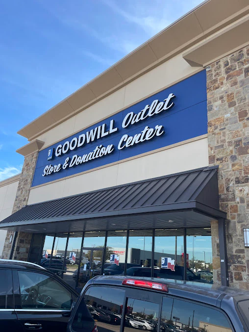 Goodwill Thrift Store - South Cypress in Katy, Texas, featuring display shelves with books and home decor items.