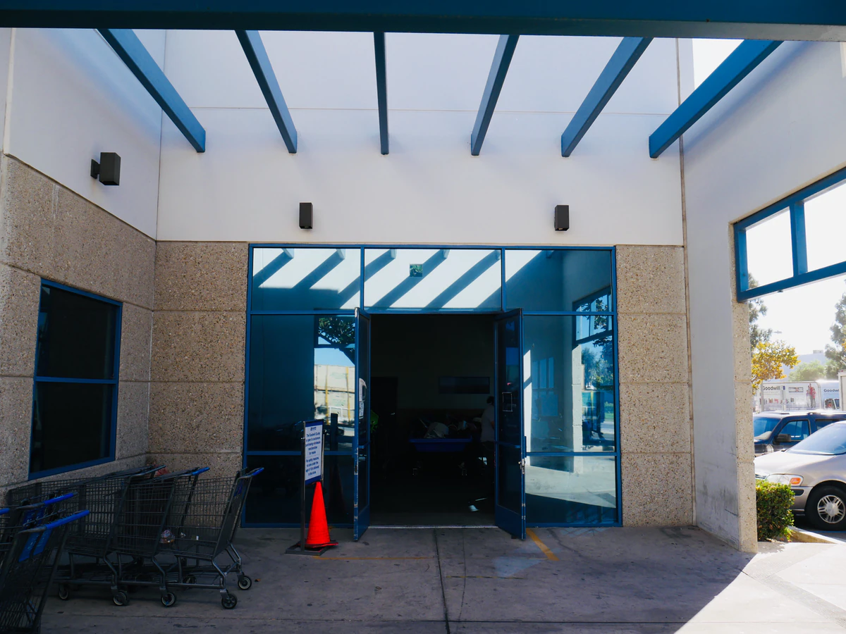 Goodwill Wholesale Outlet in Oxnard, California, showing blue rolling bins filled with discounted merchandise.
