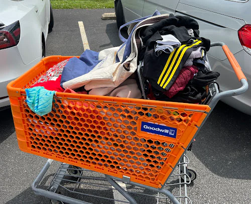 Marion Ohio Goodwill Corporate Office & Outlet Store, a Goodwill outlet store highlighting organized racks of clothing near .