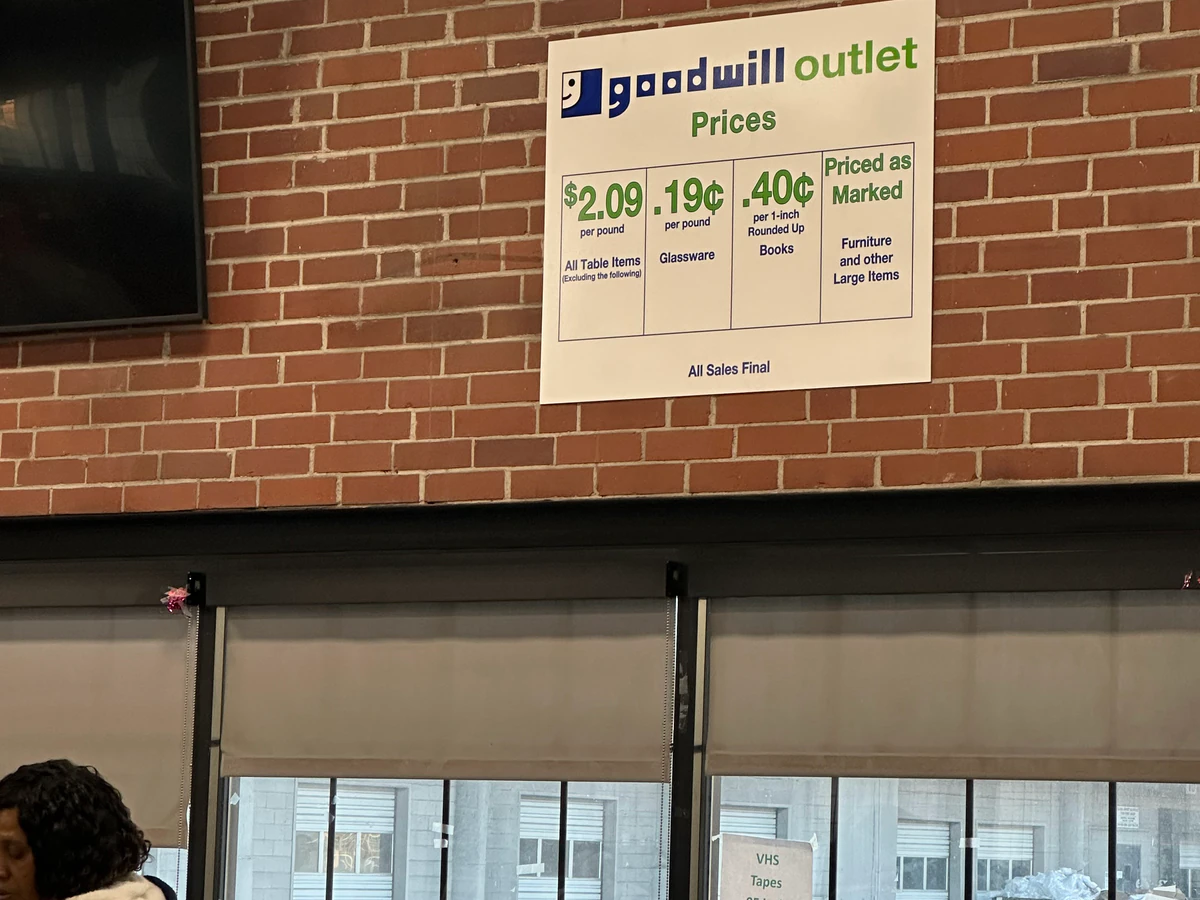 MERS Goodwill Outlet in Bridgeton, Missouri, showing blue rolling bins filled with discounted merchandise.