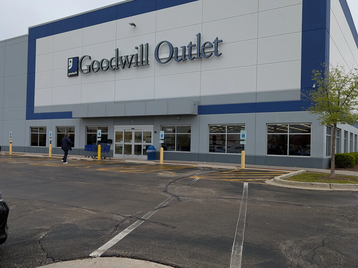 Romeoville Goodwill Outlet in Romeoville, Illinois, showing blue rolling bins filled with discounted merchandise.