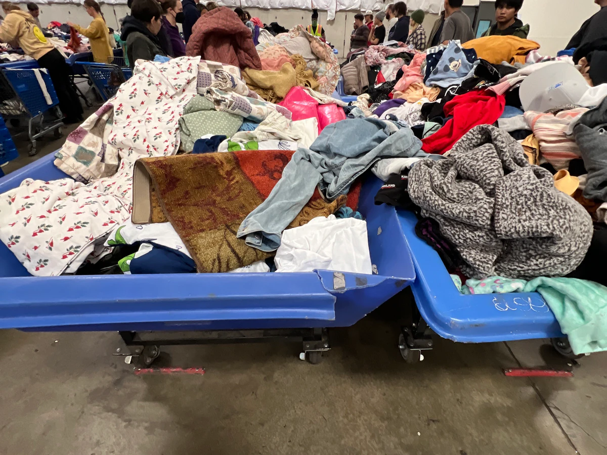 Seattle Outlet Goodwill in Seattle, Washington, highlighting organized racks of clothing near the checkout area.